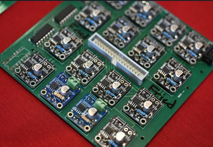 Custom driver PCB populated with H bridge drivers and shift registers