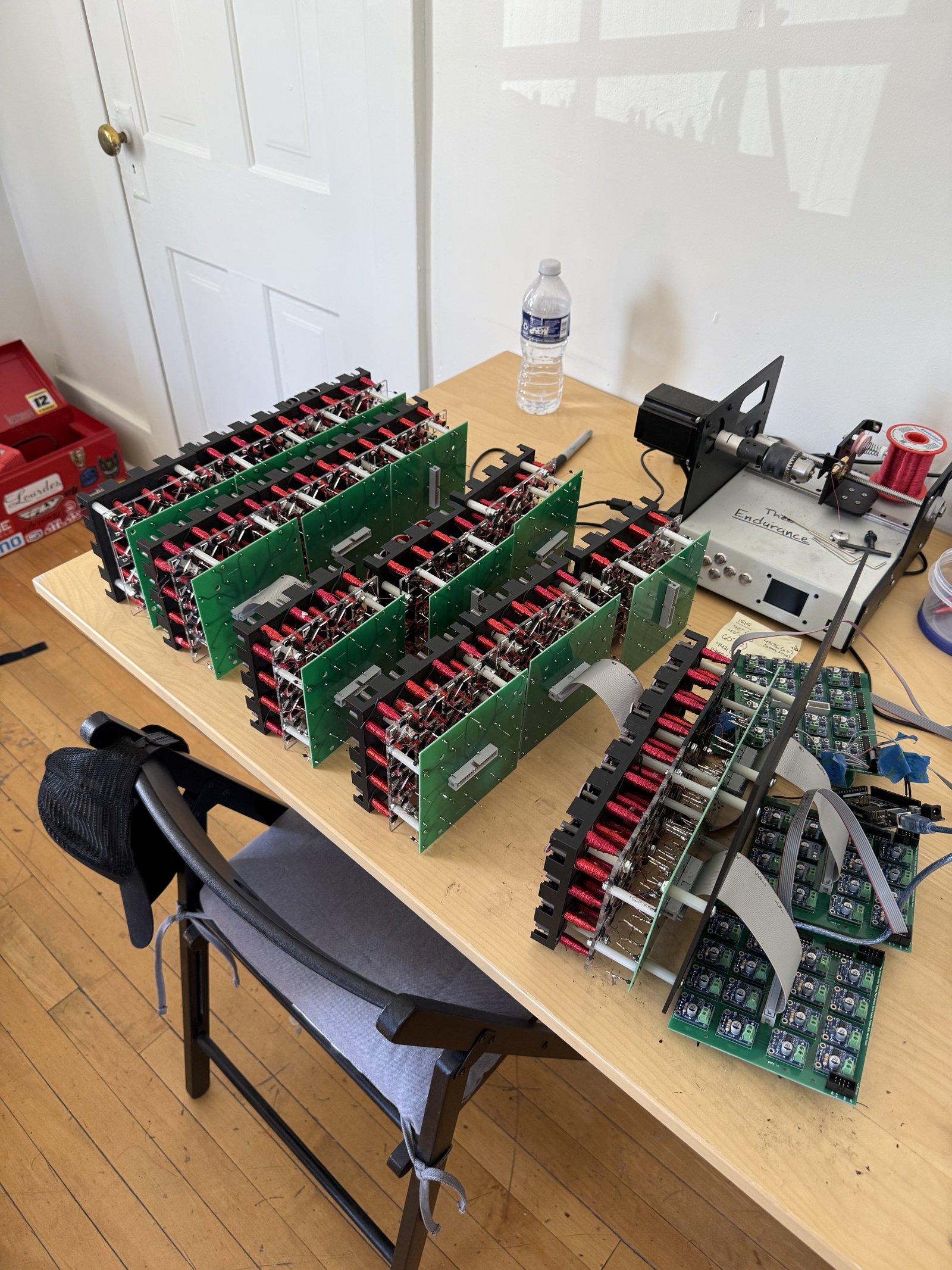 Completed display modules staged on a table before frame mounting